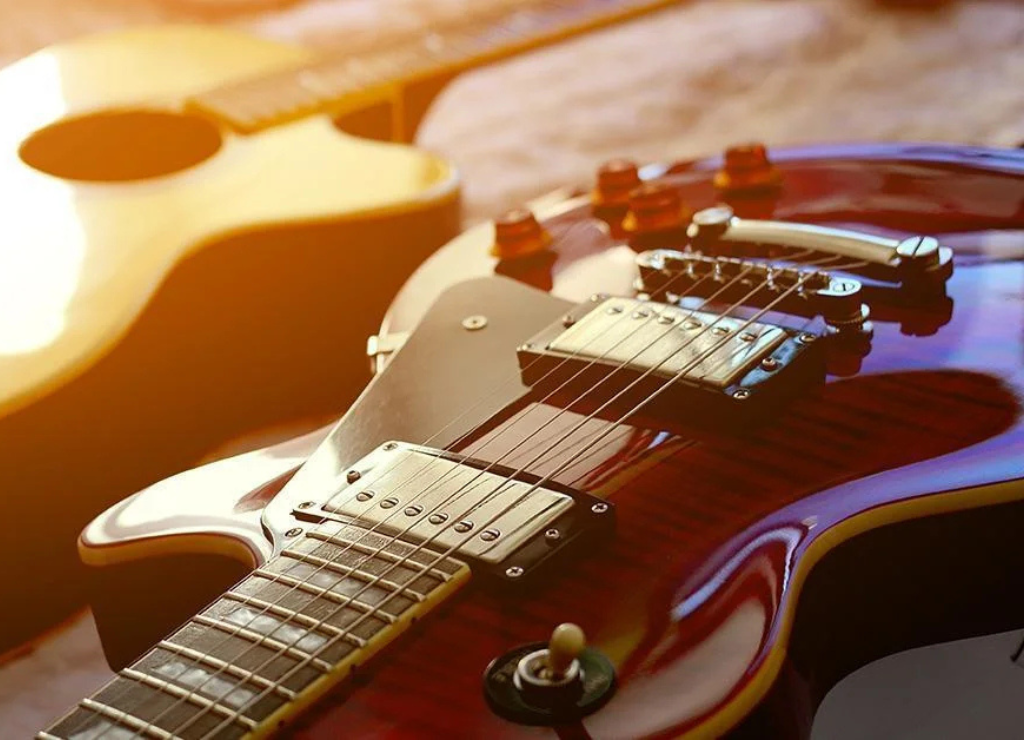Close-up shot of a red electric guitar representing our online guitar lessons